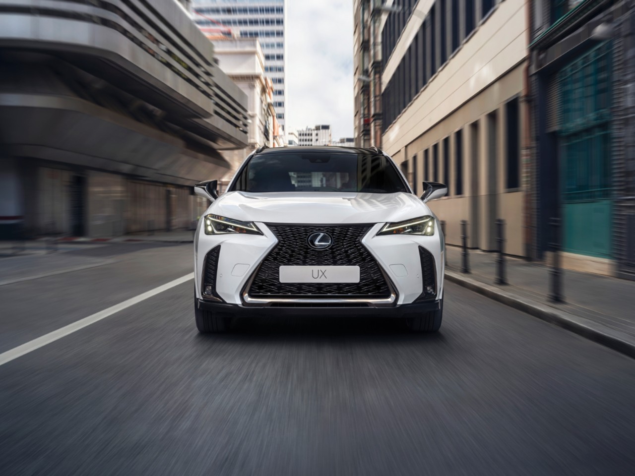 Front view of the Lexus UX driving 