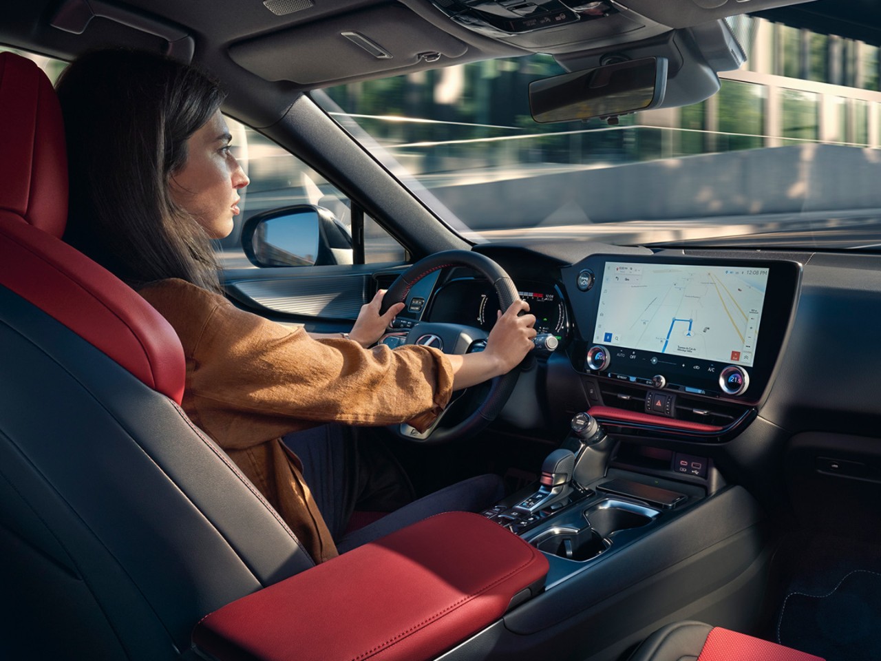 A woman driving a Lexus NX 