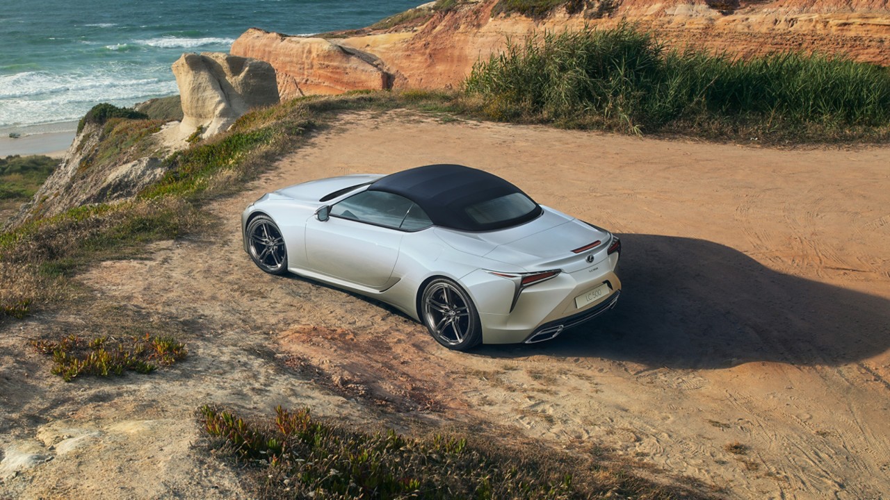 A Lexus LC Convertible parked on a coastline 